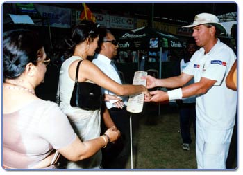 Photograph of Warne with Mr. Navarathne Banda